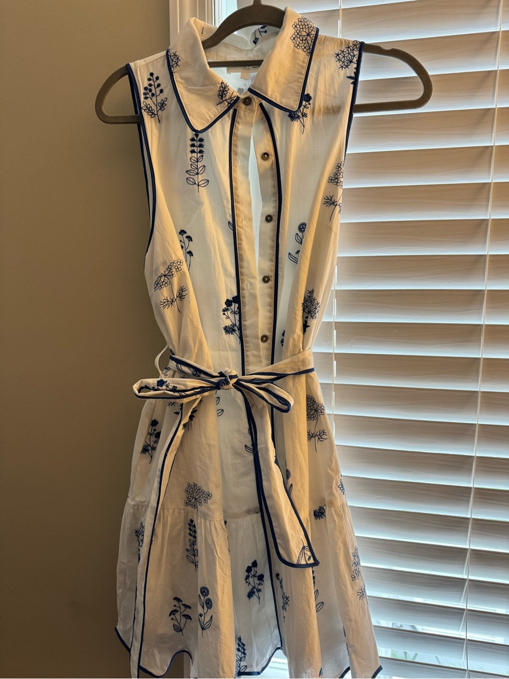 Sleeveless White Dress with Navy Floral Embroidery and Waist Tie